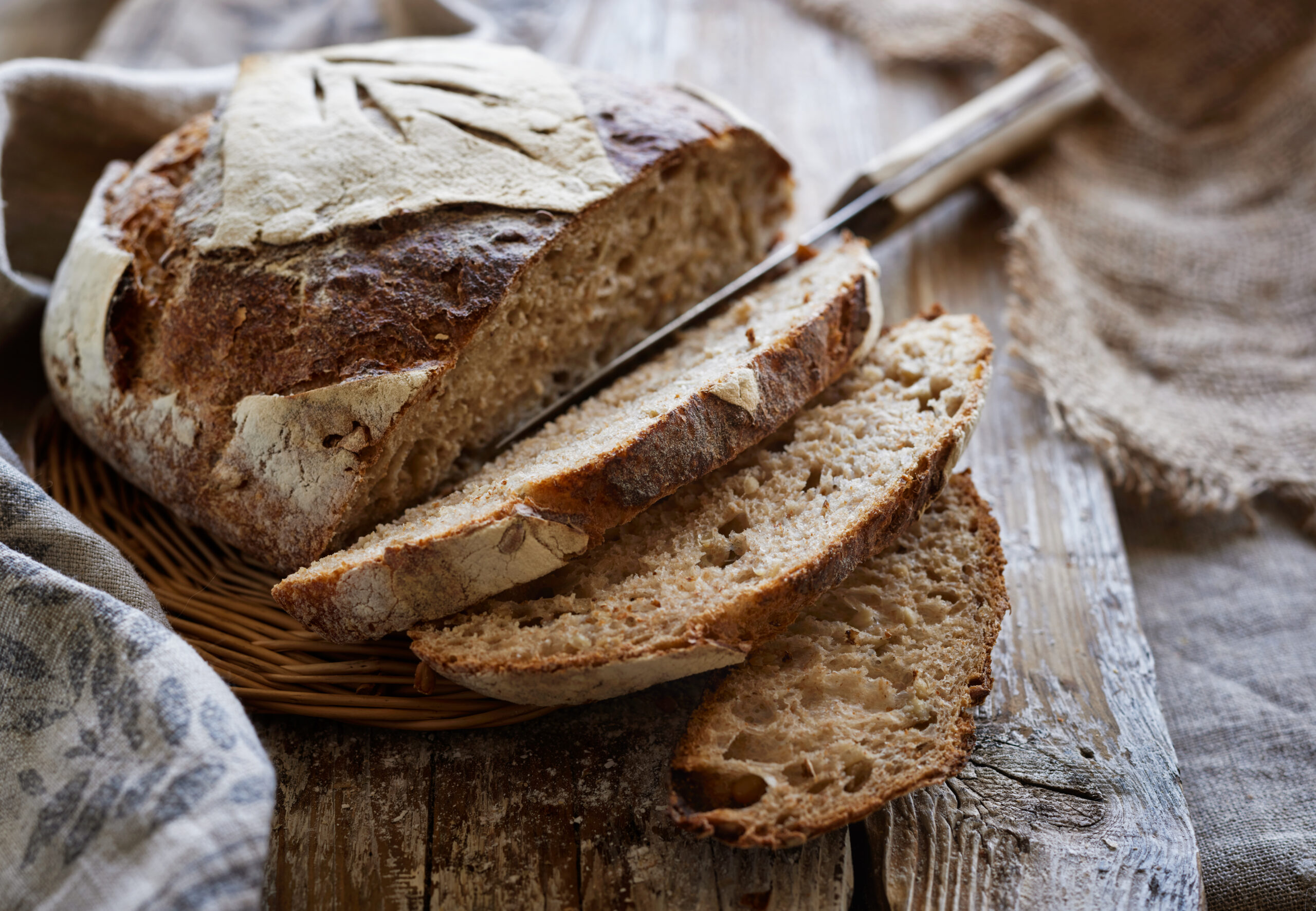 Traditional,Sourdough,Bread,,Sliced,On,A,Wooden,Board,,Close-up,View