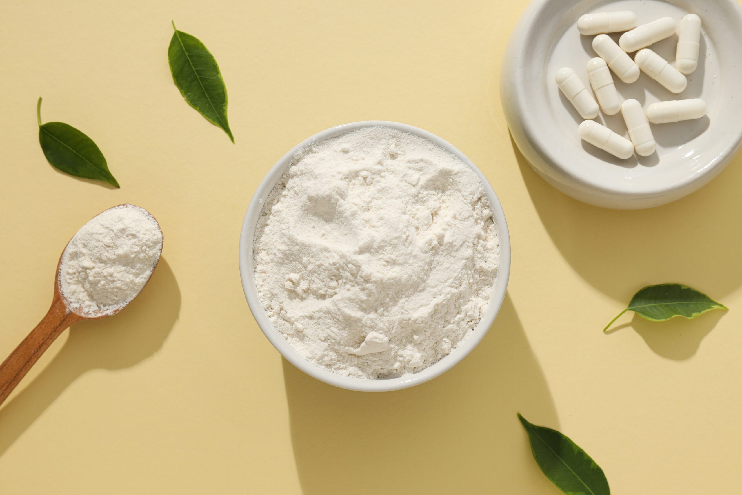 Collagen,In,Powder,And,Tablets,With,A,Wooden,Spoon