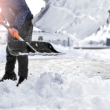 Man,Cleaning,Snow,From,Street,In,Winter,With,Shovel,After