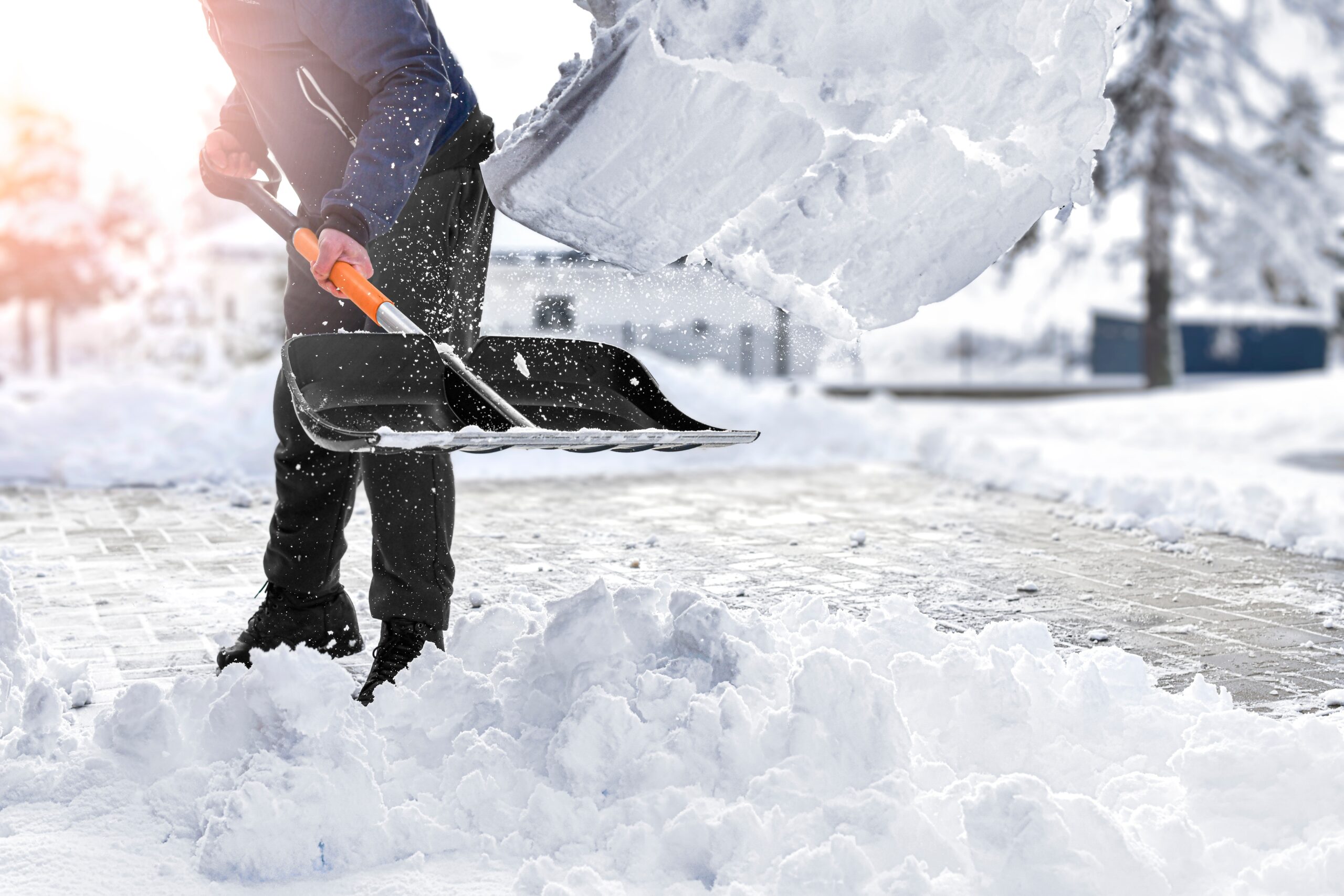 Man,Cleaning,Snow,From,Street,In,Winter,With,Shovel,After