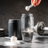 Amino,Acid,Food,Supplement,,Creatine,Powder,In,A,Measuring,Scoop,