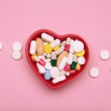 Heart-shaped,Bowl,With,A,Colorful,Assortment,Of,Various,Supplements,On